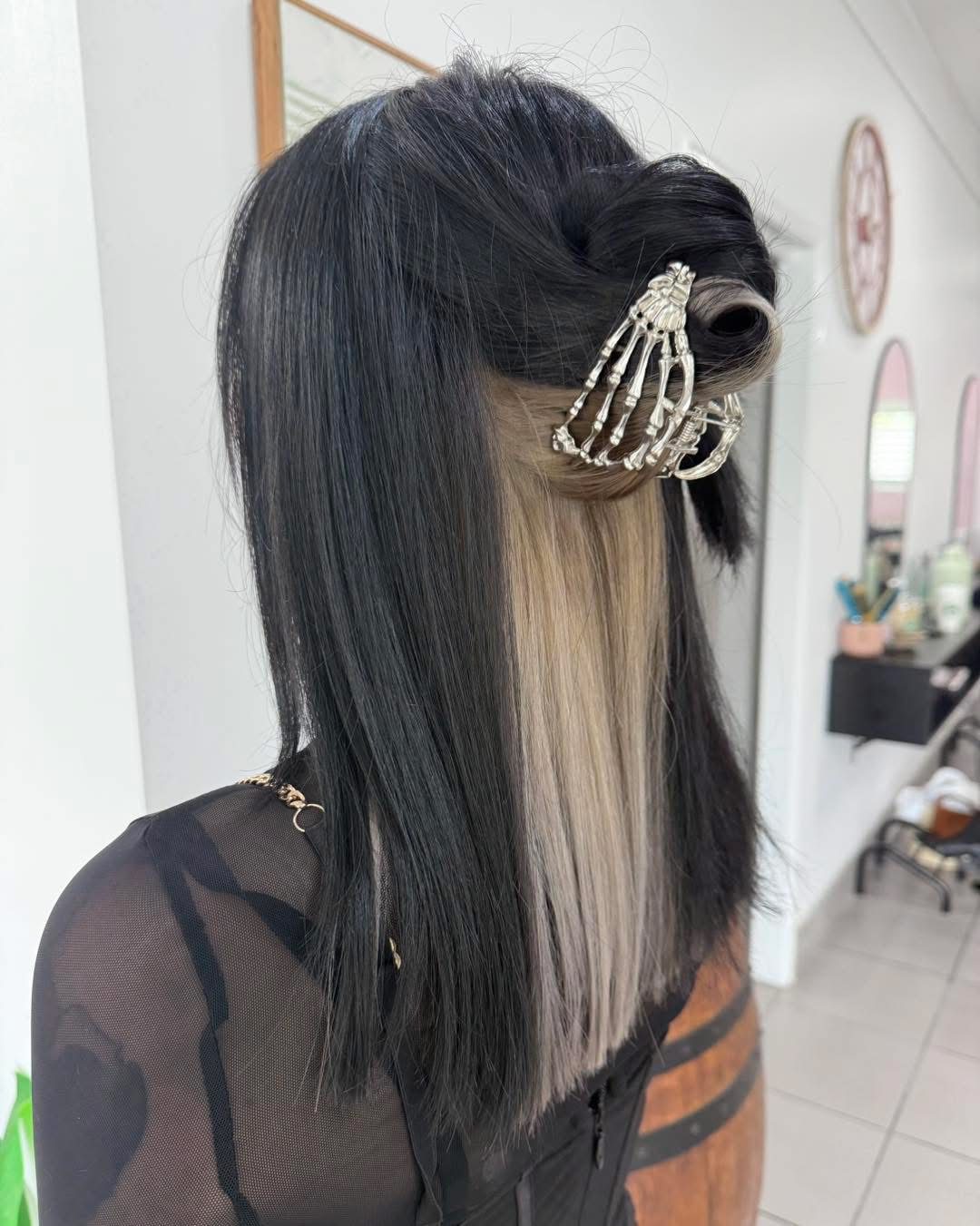 Black hair with a platinum underlayer panel