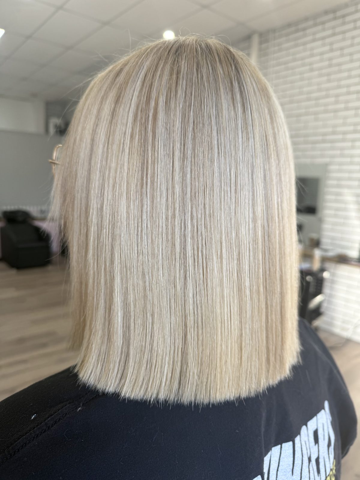 Sleek blunt-cut platinum blonde bob