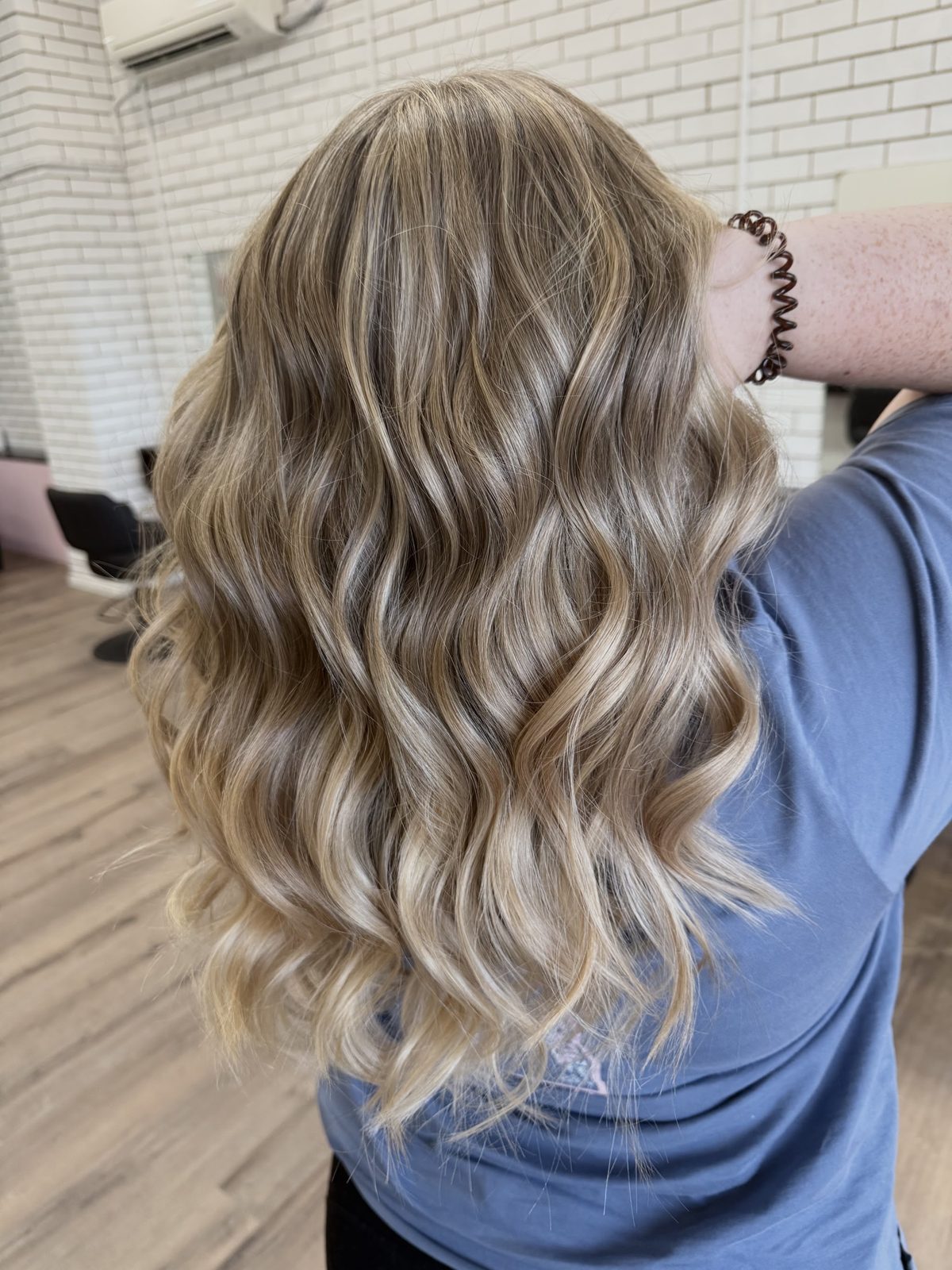 Bright blonde balayage waves finished at Studio L